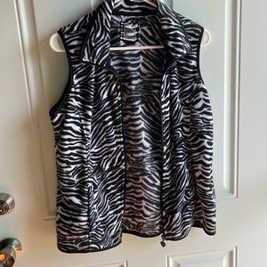 1 women’s zebra print fleece vest.